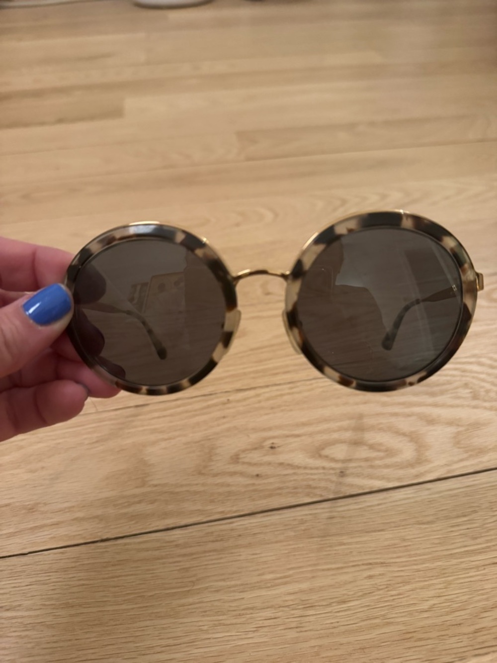 Round Prada Tortoiseshell Sunglasses - Brown Lenses with gold details.
